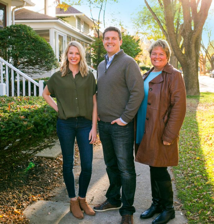 The Hub Realty team standing on a sidewalk